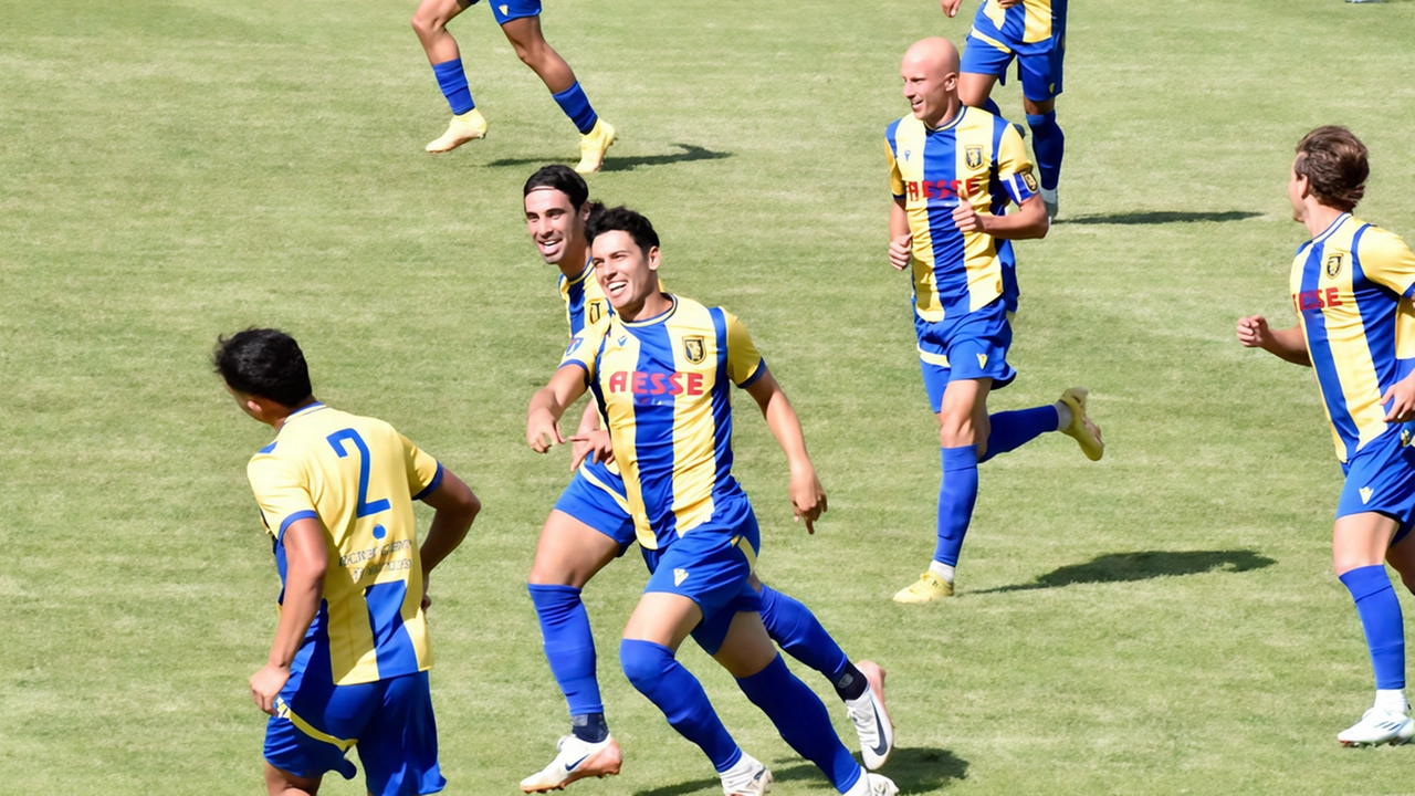 Mugelli del Figline (al centro) dopo il gol festeggiato da compagni